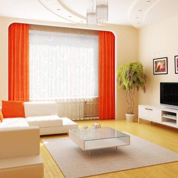 Дизайн зала в квартире в белом цвете с оранжевым декором