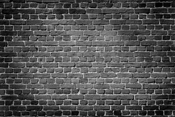Старый темный кирпичная стена — стоковое фото